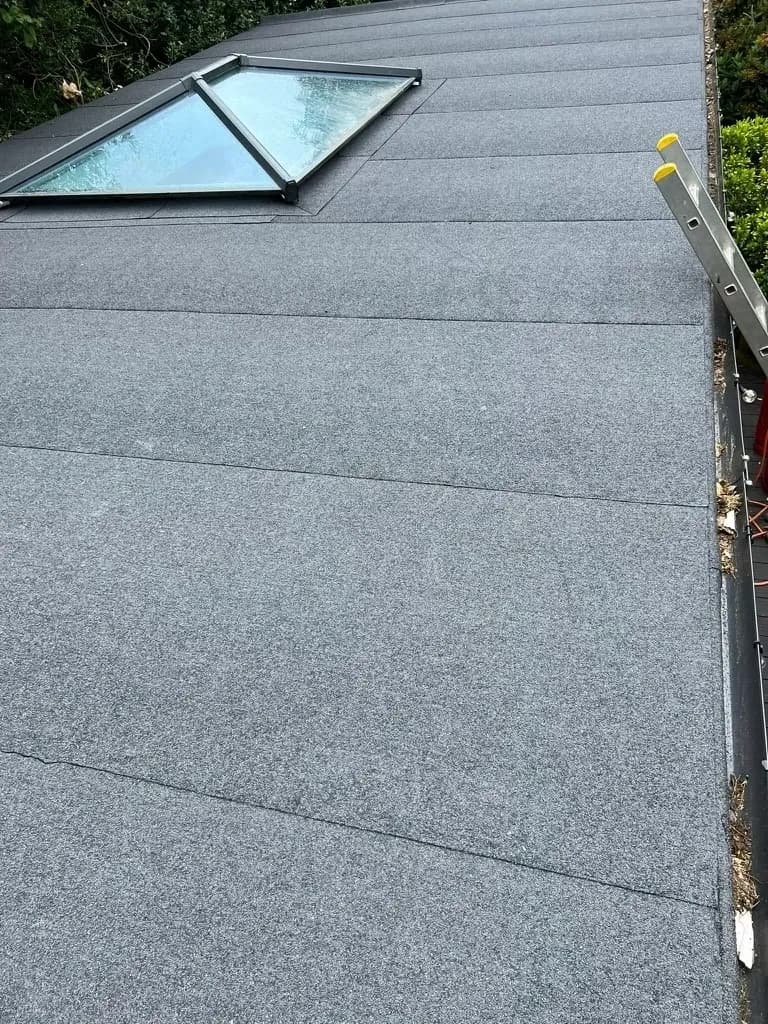 Completed flat roof with skylights after maintenance inspection
